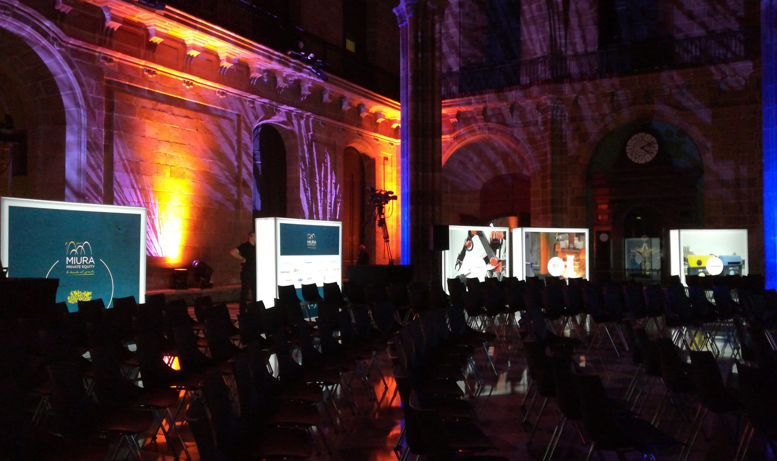 Double-sided illuminated event signage guiding attendees at a Barcelona congress